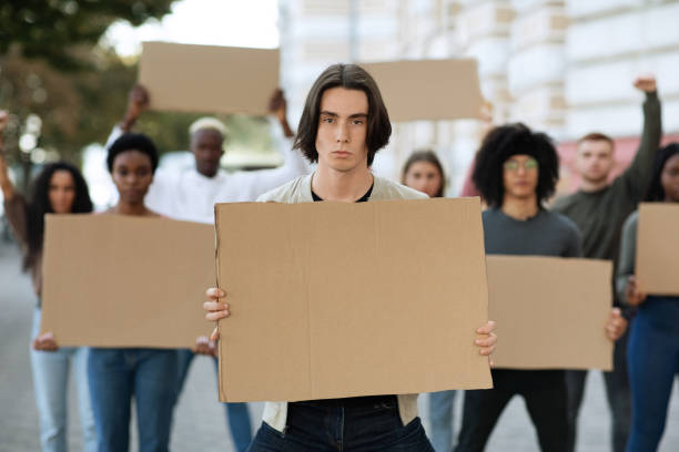 istock International group of students strikers with blank placards 1286486214