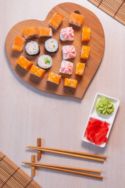 istock valentines day. Rolls stacked, soy sauce and sticks. vertical photo 1286486963