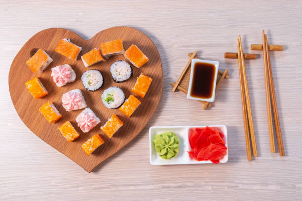 istock valentines day. Rolls stacked, soy sauce and sticks. 1286486976