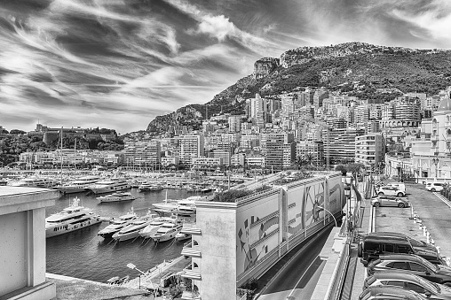 View over luxury yachts and apartments of Port Hercules in La Condamine district, city centre and harbour of Monte Carlo, Cote d'Azur, Principality of Monaco, iconic landmark of the French Riviera