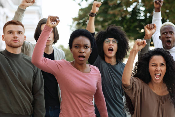 istock Multiethnic protestors striking against racism on the street 1286489659