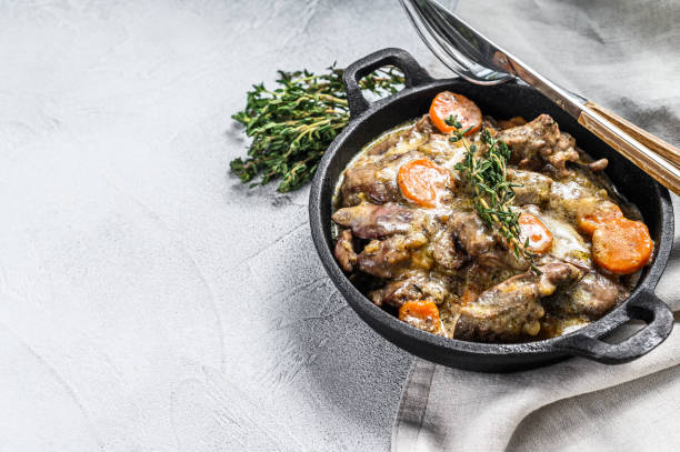 istock Stroganoff chicken liver with mushrooms and cream.  White background. Top view. Copy space 1286492276