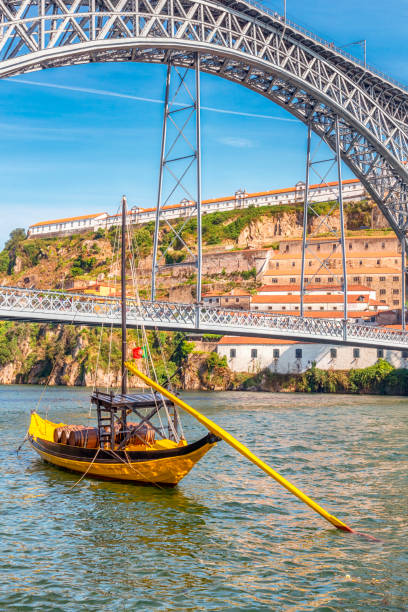 rabelo boat with douro river in porto - porto portugal bridge international landmark imagens e fotografias de stock