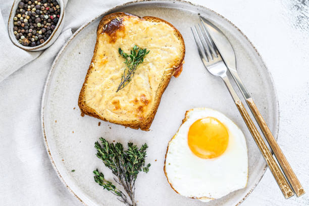 istock croque Monsieur sandwich with cheese and ham. White background. Top view 1286494148