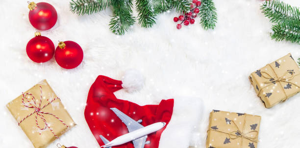 istock Travel for Christmas. Airplane with Christmas decor. Selective focus. 1286494518