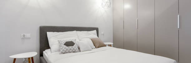 istock Small bedroom with big wardrobe, panorama 1286494592