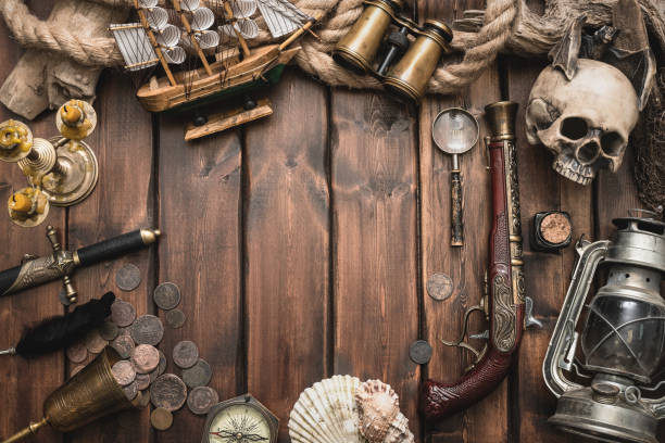 Pirate. Pirate equipment and accessories on the ancient table concept background with copy space. sword photos stock pictures, royalty-free photos & images