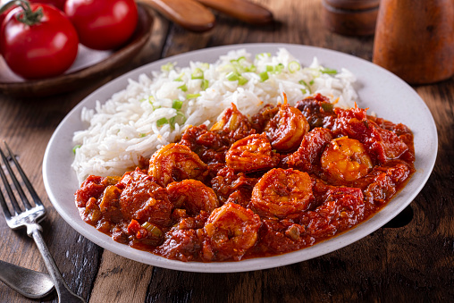 A plate of delicious southern style creole shrimp and sausage with white rice.