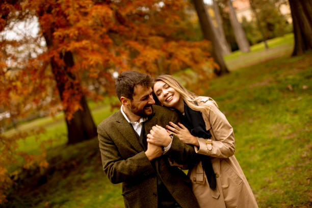 istock Young couple in the autumn park 1286498107