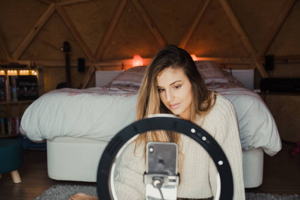 istock Young vlogger recording a video at home 1286500452