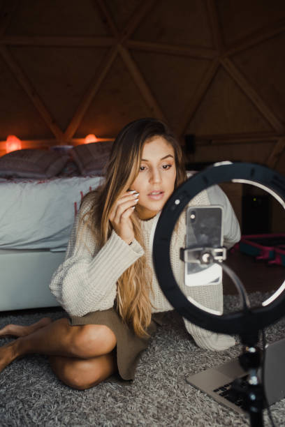 istock Young vlogger recording a video at home 1286500466