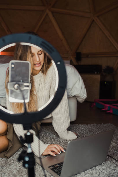 istock Young vlogger recording a video at home 1286500695