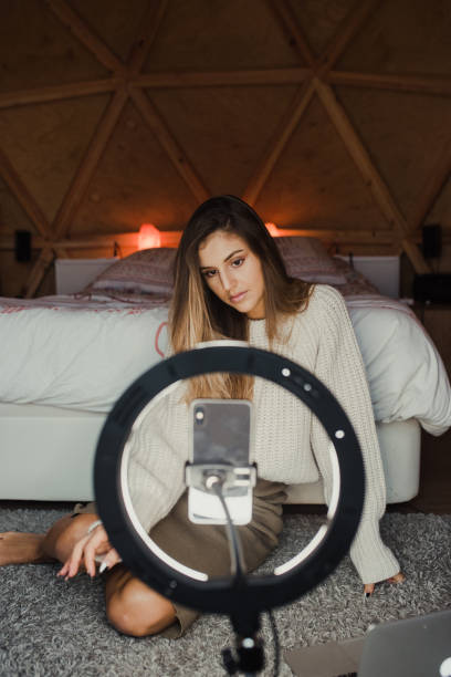 istock Young vlogger recording a video at home 1286500888
