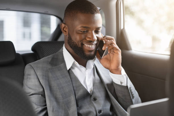 istock Smiling black businessman having conversation on smartphone 1286502522