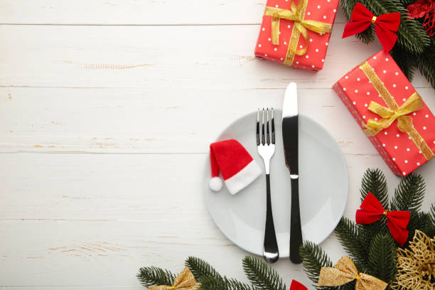 istock Christmas table place setting with decoration on white. Holidays background 1286502650