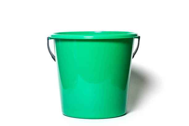 istock Bright green round plastic kitchen bucket for water or garbage isolated on white background 1286503491