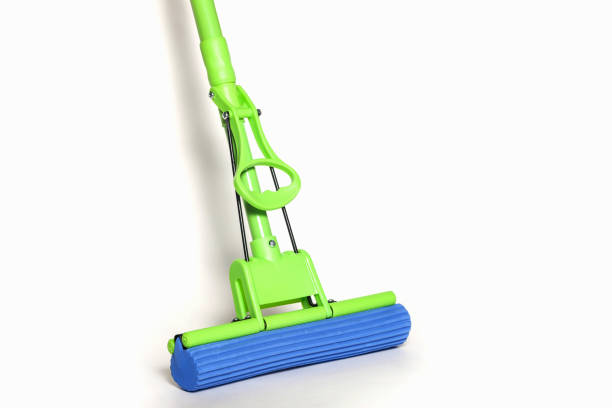 istock Green MOP with blue microfiber cloth isolated on white background in close-up 1286503507