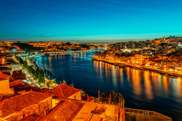 Porto Old City with Douro River at night Panoramamic view of the Ribeira District in Porto, Portugal, and the Douro River seen from the city of Vila Nova de Gaia. vila nova de gaia stock pictures, royalty-free photos & images