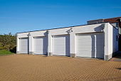 Four brand new white garages