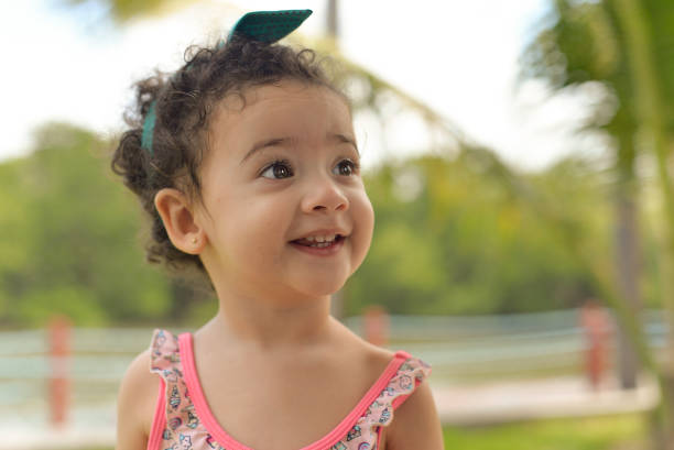 istock Child smiling on the beach 1286512388