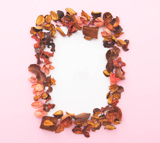 istock Seasonal composition, layout for postcard, dry petals on pink background. Space for text 1286512967
