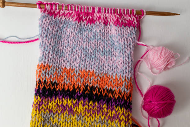 istock Knitting using technique of holding two strands of wool together 1286514214
