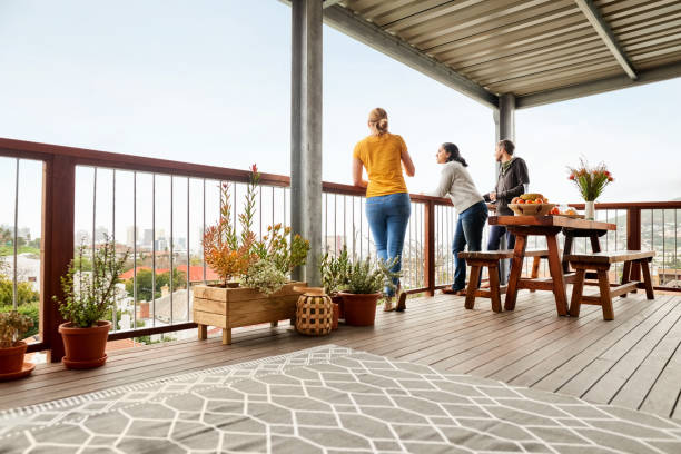 Friends at balcony Group of friends standing in balcony house railing stock pictures, royalty-free photos & images
