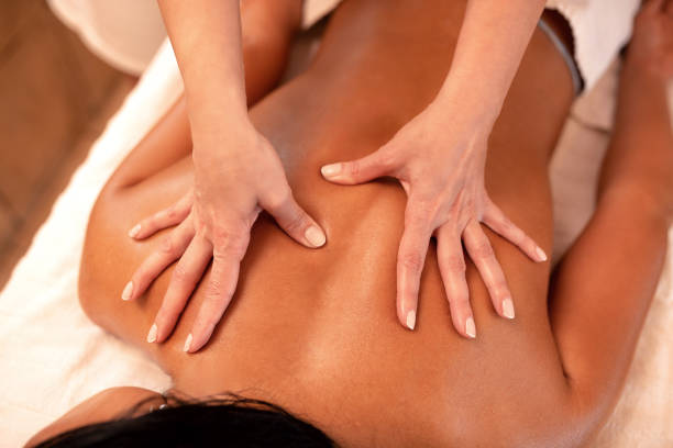 istock Dark black hair woman having a massage 1286517447
