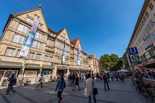 Munich, Germany - September 6th, 2018: Tourists and locals walking in the Neuhauser Strasse, shopping street and pedestrian zone in Munich downtown. Bavaria, Germany, Europe.