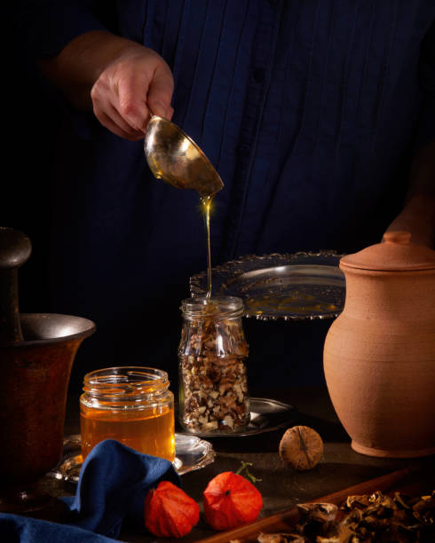 istock Cooking a delicious dessert - walnuts in honey 1286518388