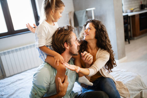 istock Happy family having fun times at home 1286520246