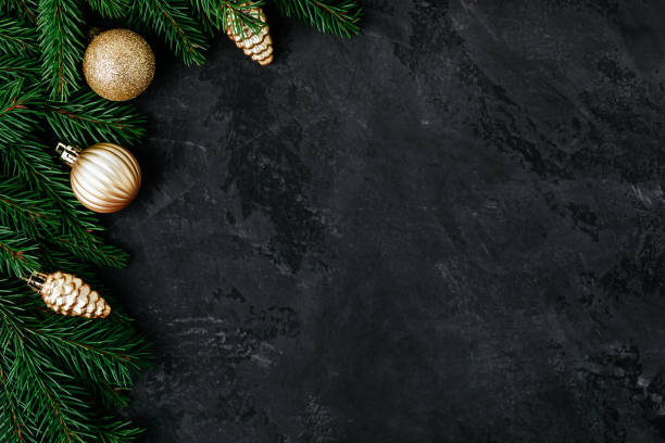 istock Christmas background with a green fir branches and gold decor. 1286520703