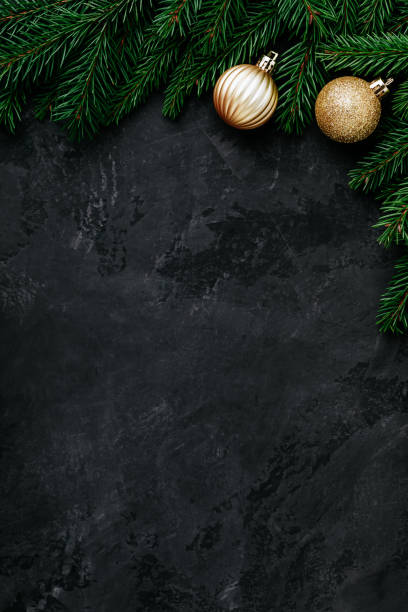 istock Christmas background with a green fir branches and gold decor. 1286520720