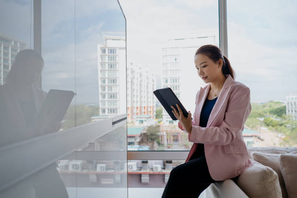 istock An Asian Chinese businesswoman using digital tablet at office 1286521905