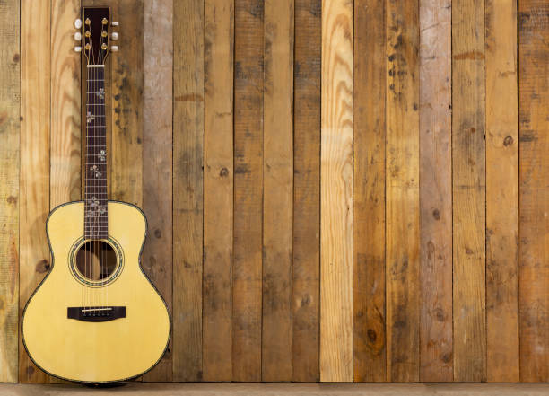 istock Acoustic guitar on wood floors 1286522229