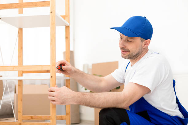 istock Repairman Fixing Cabinet Shelf Using Screwdriver Working Wearing Coverall Indoors 1286523428