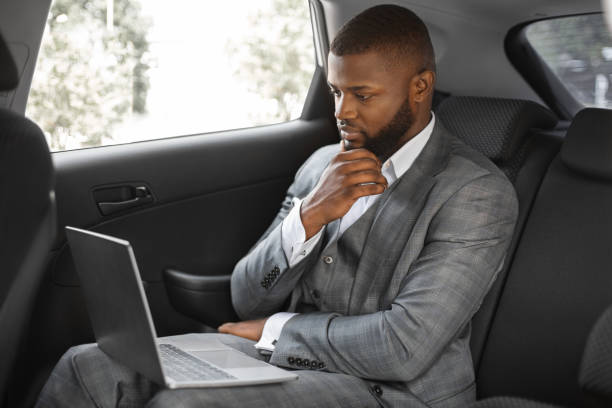 istock Black businessman working on laptop while going to business meeting 1286524181