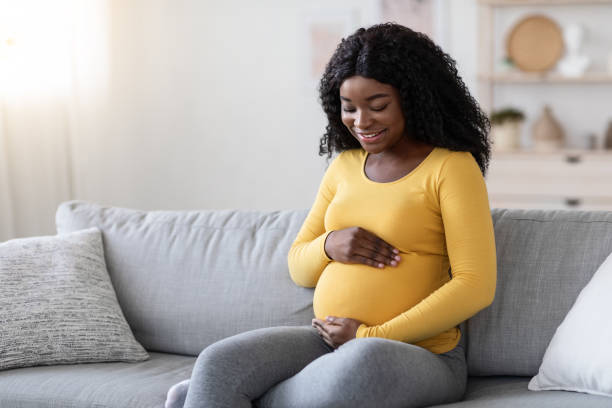 istock Happy african lady expecting child, spending time at home 1286524248