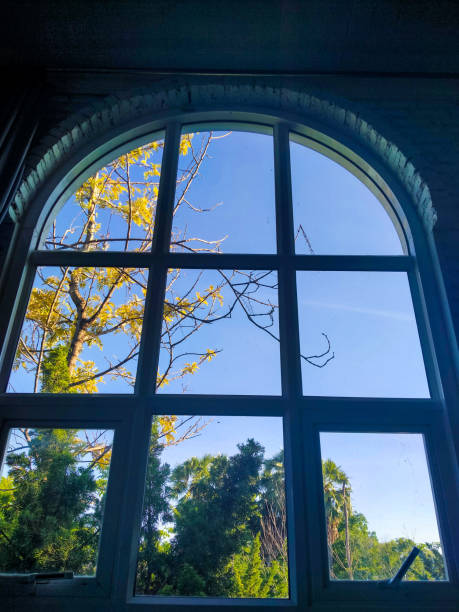 istock Arched window with view to autumnal landscape 1286525091