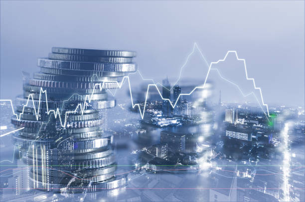istock double exposure of city with row of coin stack with growth stock chart and graph progress report for business investment finance banking and money saving concept. 1286525217