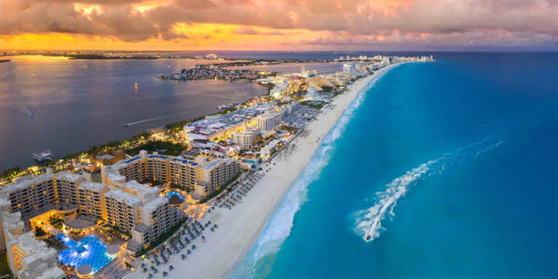 Cancun beach coast with sunsets stock photo