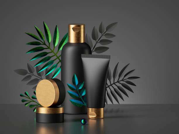 istock 3d render, black cosmetic bottles with golden caps isolated on dark background. Commercial showcase with tropical palm leaves. Set of skin care products for men, blank package mockup premium design. 1286529062