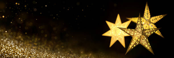 istock Gold Christmas stars on black background 1286529182