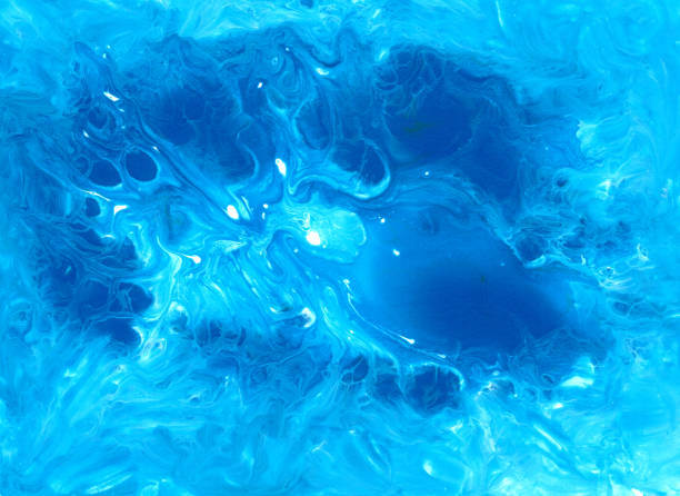 istock Abstract fluid art background. Blue, cyan and white colors mix together. Beautiful creative print. Abstract art hand paint. Original artwork. Color splashing on paper. Cosmic texture 1286529736