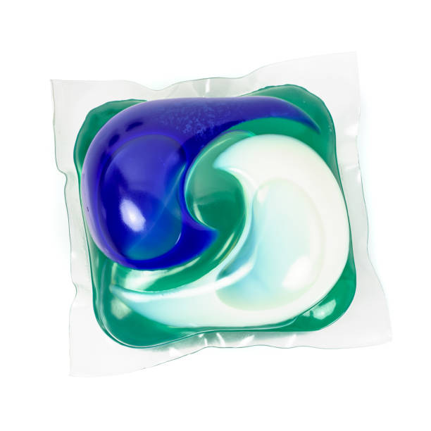 Detergent capsule on white background Detergent capsule isolated on white background with clipping path detergent capsule stock pictures, royalty-free photos & images