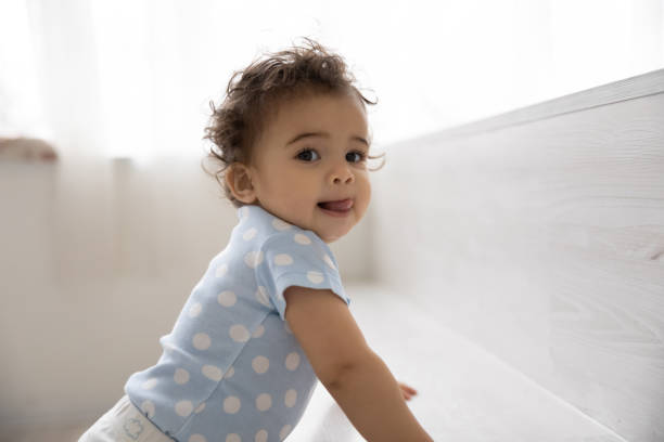 portrait of cute little biracial baby play at home - bebês meninas imagens e fotografias de stock