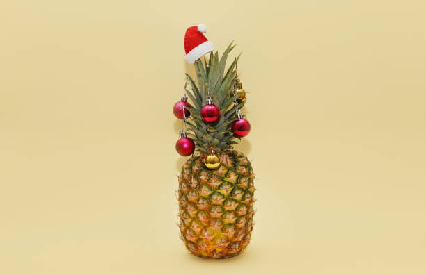 Ripe pineapple decorated with Christmas balls