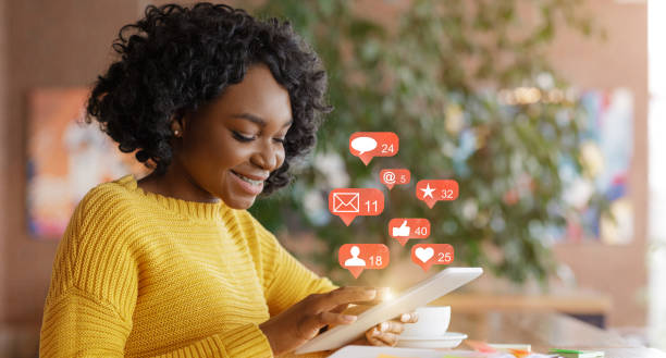 istock African Woman Using Social Media On Tablet Sitting In Cafe 1286535133