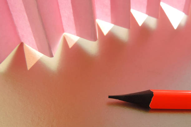 pencil on the table and corrugated paper that transmits sunlight,  Fashion shadow concept. Sunlight. Desktop, copy space.  contemporary style.