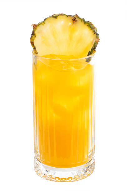 istock Green tropical pineapple and orange juice cocktail 1286536565